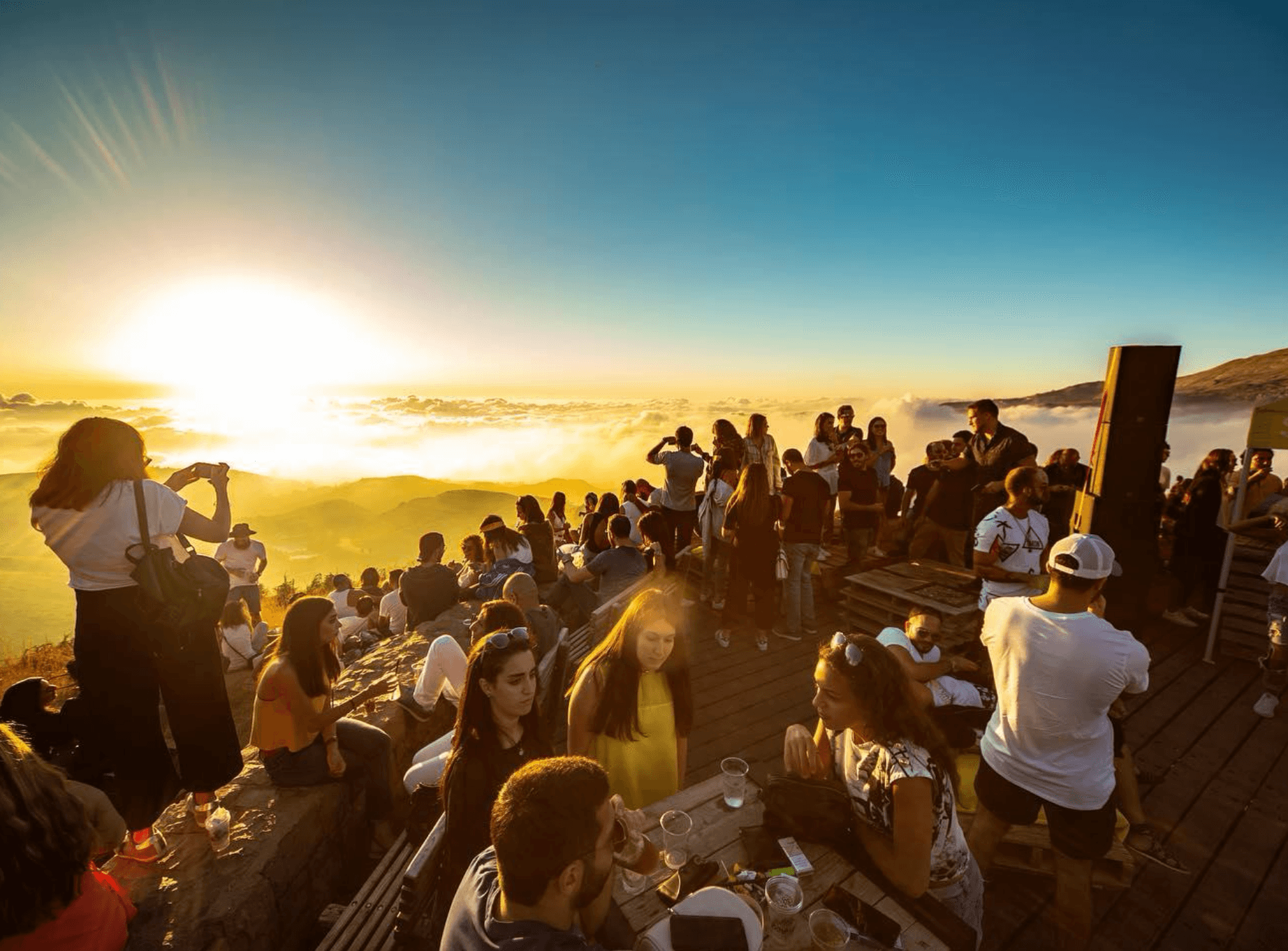 A SUNDAZE gathering in Zaarour above a field of clouds at sunset