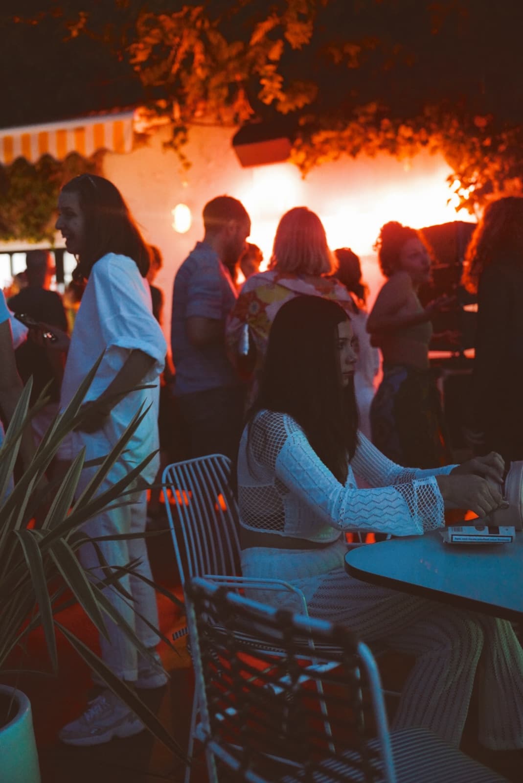 People gathering at KULÜP at sunset, 2022