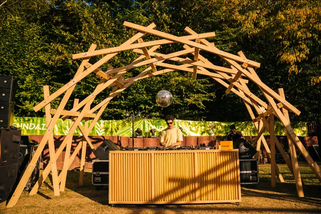 The wooden DJ booth in the garden, in daylight