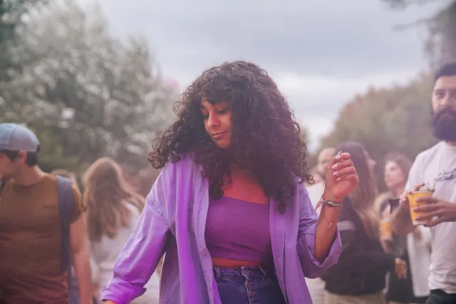 A guest in purple on the dance floor