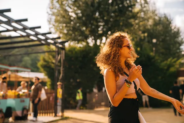 A guest dancing in the late afternoon light