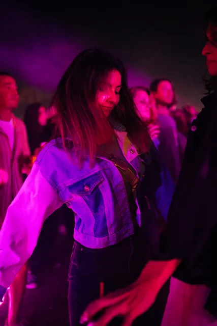 Two guests in purple light