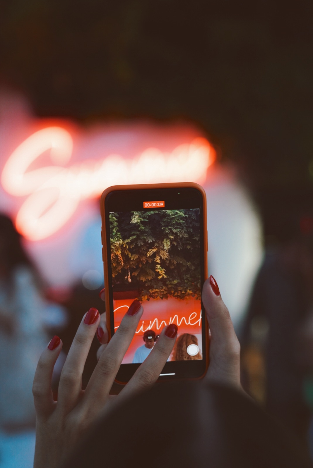 A guest recording a SUNDAZE moment on her phone